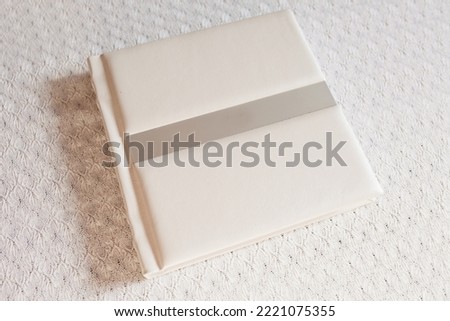 Photo book with leather cover. Stylish wedding or family photo album. Beautiful notepad or photobook with elegant embossing. Printing products. Individual products. Details