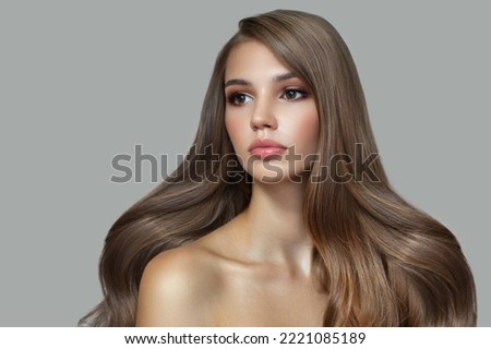 Beautiful fashion woman long curly big curls. Hair and makeup