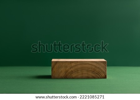 Abstract empty podium wooden geometric shapes, green background. Template for demonstrating products Royalty-Free Stock Photo #2221085271