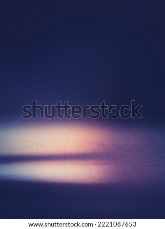 Blue sky with clouds. Abstract background with light and shadows over stucco wall. Moody painting style long exposure photography.