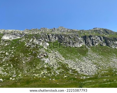Rocky mountain peaks Poncione di Fieud (2696 m) and Fibbia (2738 m) in the massif of the Swiss Alps above the St. Gotthard Pass (Gotthardpass), Airolo - Canton of Ticino (Tessin), Switzerland (Schweiz Royalty-Free Stock Photo #2221087793