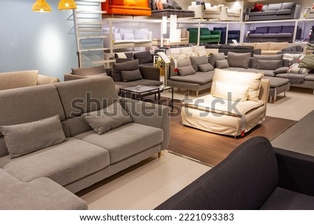 Showroom in the upholstered furniture store department with sofas Royalty-Free Stock Photo #2221093383