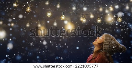 A little girl rests on top at christmas - childhood belief Royalty-Free Stock Photo #2221095777