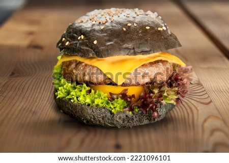 Tasty fresh fast food Burger on the desk
