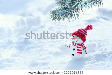 Christmas background. cute snowman and pine tree branch in snow. New Year and Christmas holidays. festive winter season. copy space. template for design