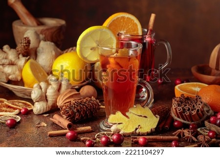 Hot Christmas drinks with spices and fruits.