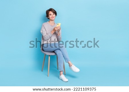 Full length size photo of adorable pretty lady use telephone roll instagram twitter telegram empty space isolated on blue color background