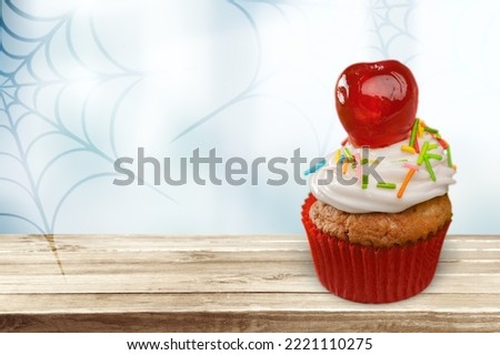 Tasty sweet cupcake dessert on the desk