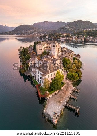 Island of San Giulio in the beatuful landscape of Lake D'Orta in Piemonte, Italy. Picture taken at sunrise, in Autumn. Close Up 
