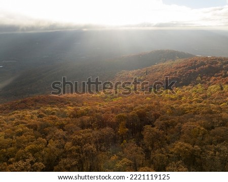 Aerial photo of Georgia Mountains during a beautiful fall sunset with sun rays