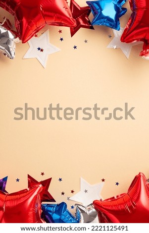 Forth of July concept. Top view vertical photo of balloons in national flag colors star garland and confetti on isolated beige background with blank space