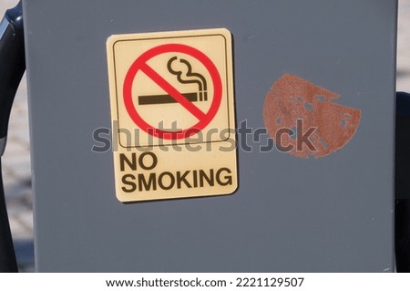 No smoking sign with cigarette symbol crossed out on grey background