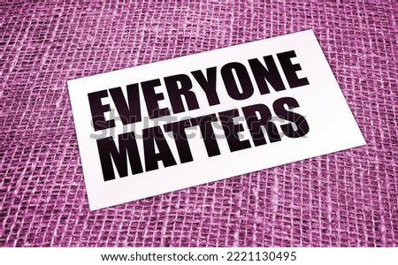 Everyone Matters written on a card on burlap canvas. Equality social concept
