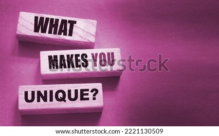 What makes yiu unique - phrase on Wooden blocks. Business or carees success concept
