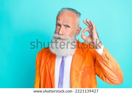 Portrait of serious confident aged person hand fingers demonstrate okey symbol isolated on teal color background