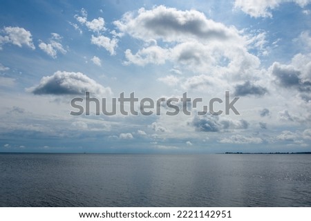 Sea view with reflection of the clouds on the surface