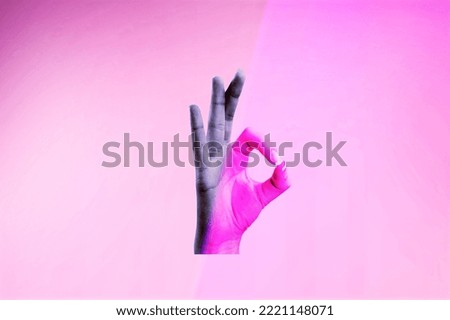 Person's hand show gesture on colored background