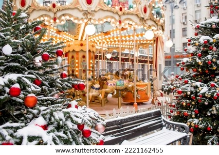 Christmas decoration of the streets. in classic red and green tones. Beautiful festive landscapes in the city. Decorated Christmas trees.