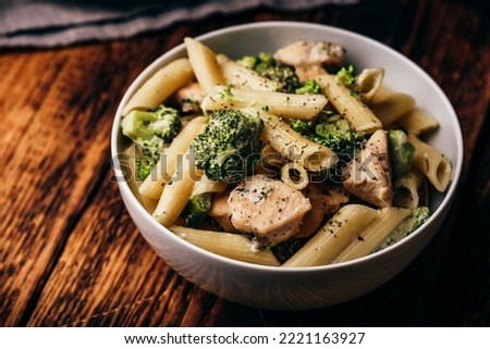 Creamy whole wheat pasta with chicken and broccoli Royalty-Free Stock Photo #2221163927