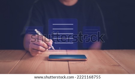 Businessman using a pen to sign electronic documents on virtual screen, Electronic Signature Concept, E-signing, Data sheet digital document management, paperless office, online working technology.