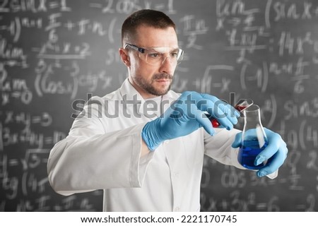 Young scientist hold flask for laboratory test