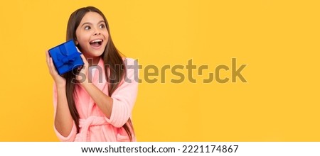 sweet dreams. comfortable pajama or home bathrobe. teen girl feeling surprised. Kid girl with gift, horizontal poster. Banner header with copy space.