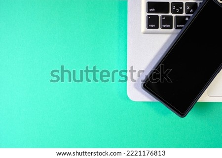 Laptop and Smartphone Image - Green Background