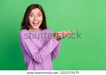 Side profile photo cute attractive lady shocked holding hands product how cheap for low cost isolated on green color background