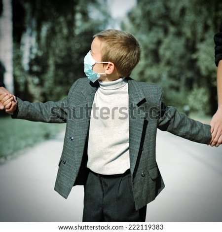 Toned Photo of Kid in the Flu Mask on the Street
