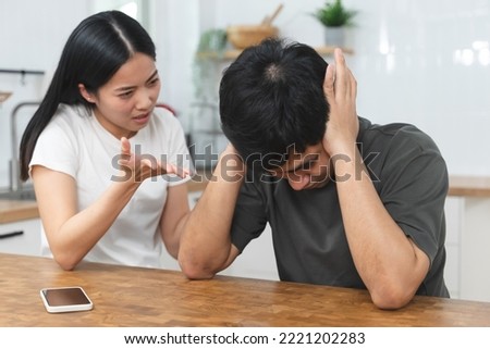 Husband is cheating on wife after having affair on social media app. Royalty-Free Stock Photo #2221202283