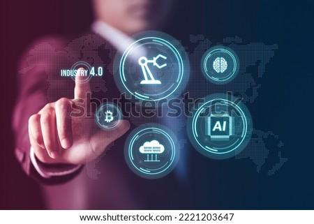 Businessman showing virtual industry 4.0 concept, IoT, automation monitoring system. Robotics and digital manufacturing operation industrial technology, Global futuristic automatic technology concept.