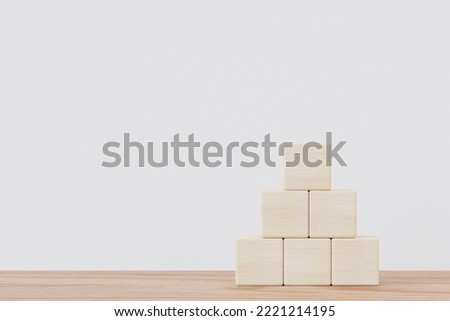 blank wooden cubes on table with copy space for input wording and infographic icon.