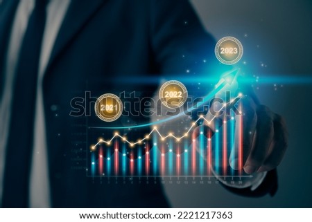 Businessman Hand and Finger Press or Touch Color Stock Graph and 2023 Trend Icon with World Map. Financial, Economics, Business and Technology Concept in Vintage Tone