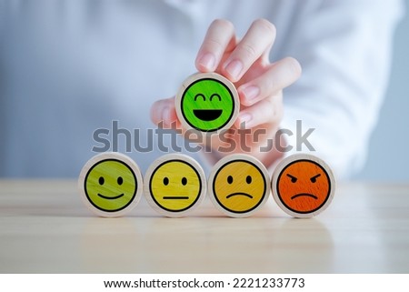 Feedback rating and positive service review. Customer experience, Mental health assessment, World mental health day, think positive, Emotion, satisfaction survey. Hand choosing happy smiling face. Royalty-Free Stock Photo #2221233773