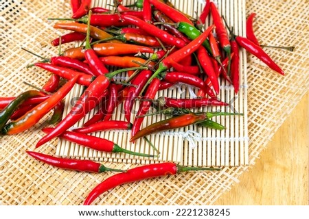 Group of red chili lay on a wooden board,Thai herb, Spicy ingredients for food.