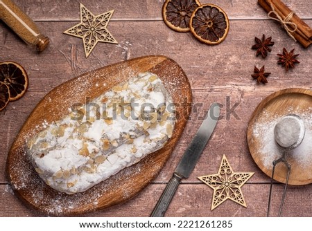 Food photography of marzipan stollen, dessert, sugar, powder, cinnamon, anise, star, decoration, christmas