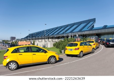 taxi cars lining up for pickup at airport Royalty-Free Stock Photo #2221263639