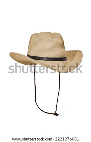 Close-up shot of a men's cowboy straw hat decorated with a leather strap with a metal buckle. The beige cowboy straw hat with a woven chin strap is isolated on a white background. Front view.