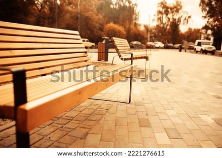 Bench in a park on a sunny autumn morning. Morning.
