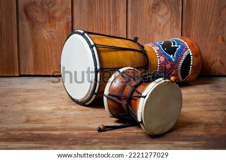 Damaru and djembe drums, percussion and musical instruments. Royalty-Free Stock Photo #2221277029