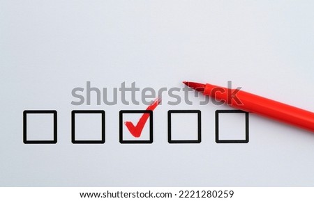 Red pen marking on checklist sheet