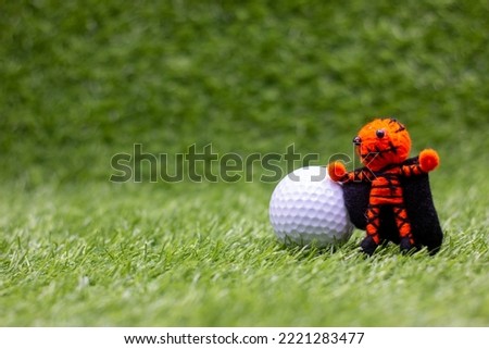 Golf Halloween with Pumpkin Ghost on Green grass