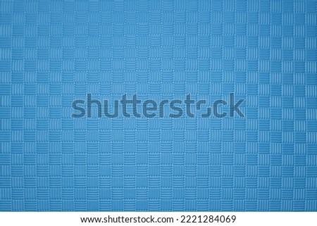 Blue rubber mat for yoga, judo or kids playground, background, texture Royalty-Free Stock Photo #2221284069