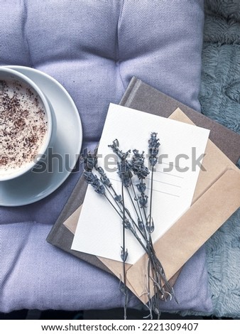 Cup of coffee and lavender flowers
