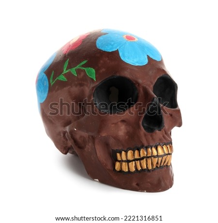 Painted skull for Mexico's Day of the Dead (El Dia de Muertos) on white background