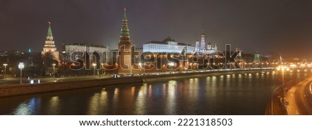 Moscow downtown in spring bright night. Kremlin Towers, the Grand or Large Kremlin Palace, Ivan the Great Bell Tower, Dormition Cathedral. Kremlevskaya embankment. Long exposure photography. Panorama
