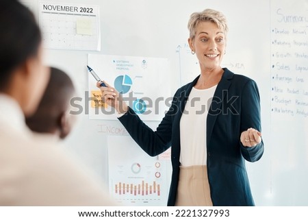 Training, business woman and leader presentation for finance update, marketing data and seminar for chart, discussion and planning budget. Trainer, female mentor or coach speaking, strategy and sales Royalty-Free Stock Photo #2221327993