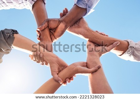 Hands, community and link team together global community of cooperation on blue sky. Group diversity in volunteer partnership, social solidarity or collaboration friends of circle arms and teamwork Royalty-Free Stock Photo #2221328023