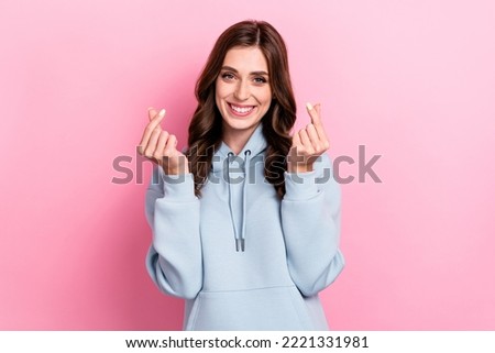 Photo of cute cheerful person toothy smile hands fingers demonstrate korean love heart symbol isolated on pink color background