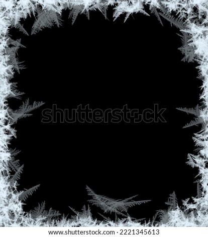 A frame of a frosty pattern  on a black background. A frame with an abstract ice structure allows you to apply or add a frost effect. Frost on the glass, freezing effect Royalty-Free Stock Photo #2221345613